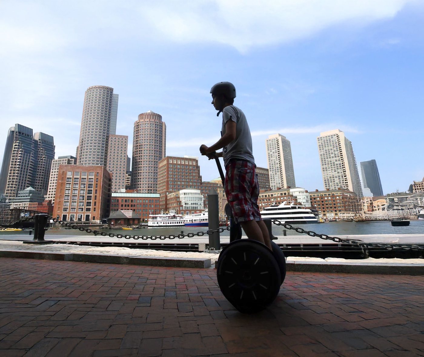 A Segway: a two-wheeled, self-balancing personal transporter invented by Dean Kamen.